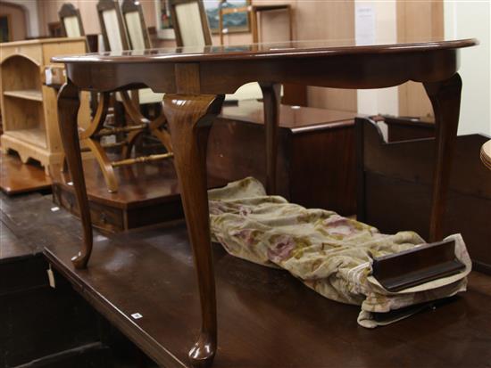 A 1930s mahogany extending dining table, plus two leaves	 W.152cm